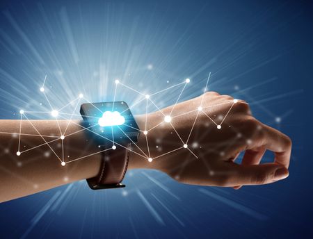 Close up female hand with smartwatch and with cloudy and connection icons around