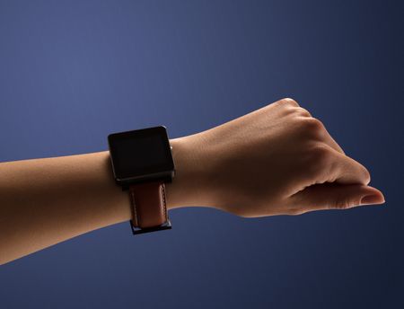 Close up female hand with smartwatch and dark background and black screen