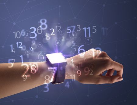 Close up female naked hand wearing smartwatch and numbers around