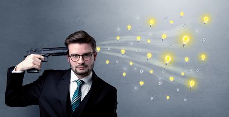 Man shoots his head with gun and idea bulbs are coming out from his head