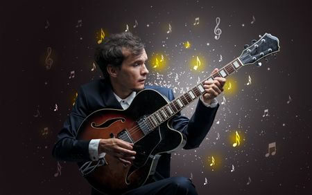 Young guitarist with falling musical notes wallpaper and classical concept