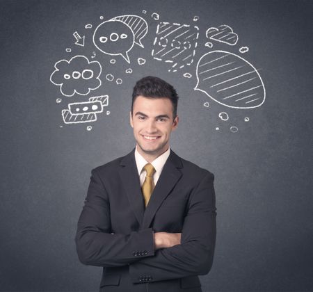 Young businessman with drawn speech bubbles over his head