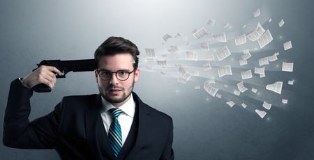 Handsome businessman shoots his head with gun and documents coming out from his head