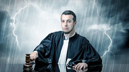 Young handsome judge with stormy wallpaper 