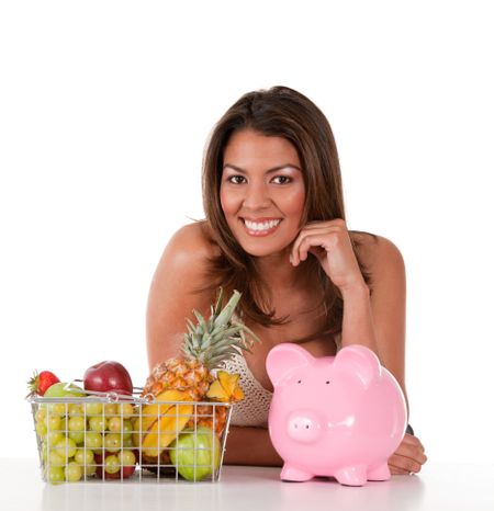 Healthy eating woman with a basket of fruits ? isolated over white