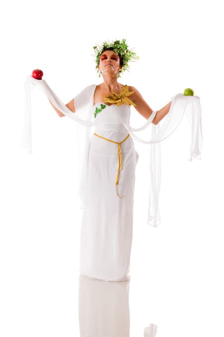 Beautiful fullbody Greek goddess holding apples - isolated over a white background