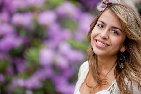 Portrait of a beautiful woman smiling outdoors