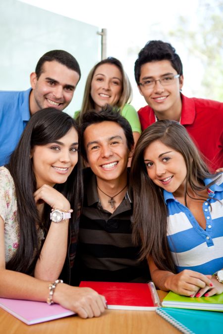 Group of casual young people smiling - indoors