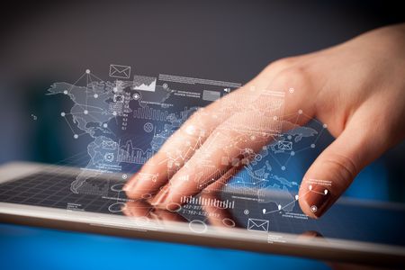 Female hands touching tablet with maps and charts 