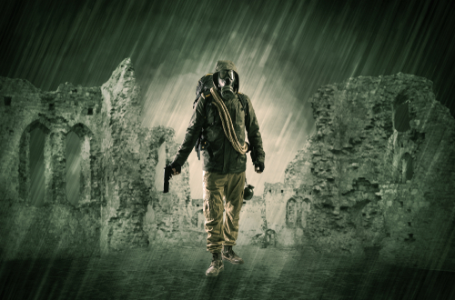 Hazard, menace man in a ruined crumbly building with arms on his hand