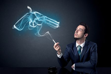 Businessman resting and smoking in a dark room.
