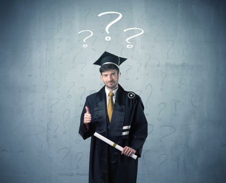Young graduate teenager with question marks drawn over his head