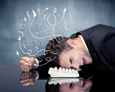 A depressed businessman resting his head on a keyboard and shouting with illustration of ideas, arrows, lines leaving his head concept
