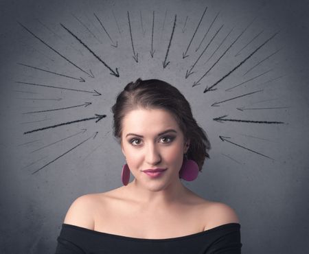 teenage-student-girl-pressure-making-happy-787997038 A teenage student girl under pressure while making happy face expressions illustrated with black arrows pointing at her head on the wall blackground concept.