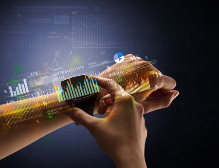 Cloe up naked female hand with smartwatch with financial symbols around