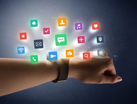 Naked female hand with smartwatch and  application labels around and dark background