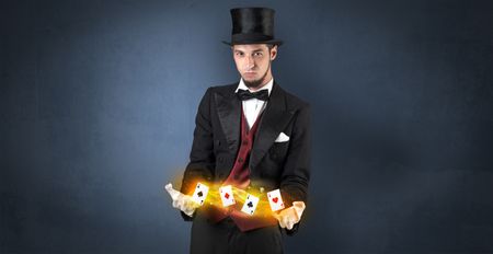 Illusionist in tails bandy play cards between his two hands