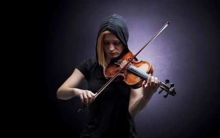 Lonely violinist composing on cello with nothing around