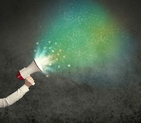 Caucasian business hand holding megaphone with white sparkles on a grunge background