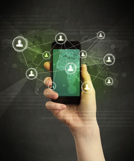 Caucasian hand in business suit holding a smartphone, social network concept