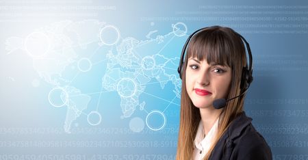 Young female telemarketer with blue background and world map and numbers behind her