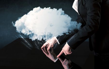 Male hands touching interactive table with a white cloud on it