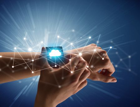 Close up female hand with smartwatch and with cloudy and connection icons around