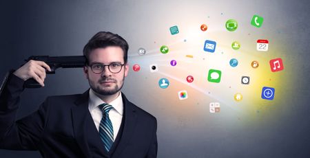 man-shoots-head-gun-application-icons-789203797 Man shoots his head with gun and application icons coming out from his head