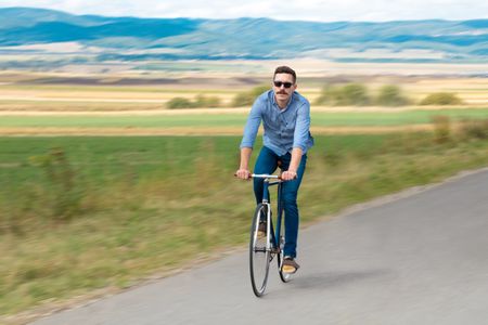 Natural view with cyclist going somewhere with stylish bike