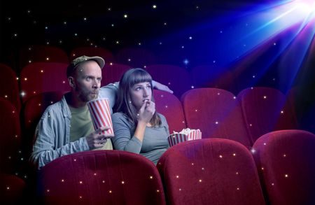 Lovely couple watching 3D movie with little sparkling stars around