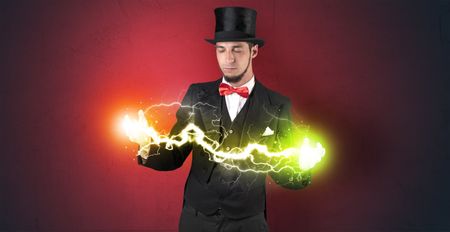 Magician sparkling super power between his two hands