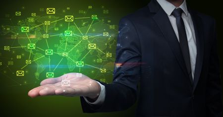 elegant-businessman-holding-communication-concept-hand-789217771 Elegant businessman holding communication concept on his hand