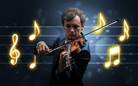 Young handsome fiddler playing with music sheet background