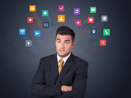 Young businessman with colorful applications over his head 