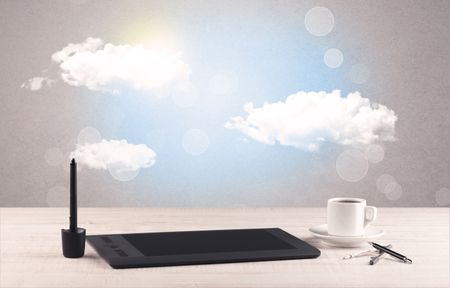 Close up of business office desk concept with clouds, blue sky and sunshine