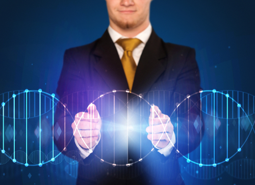 Businessman with DNA concept in his hands 