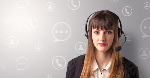 Young female telemarketer with white speech bubbles around her