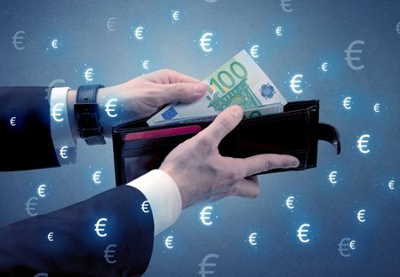 Businessman's hand takes out euro from a wallet with euro symbol wallpaper