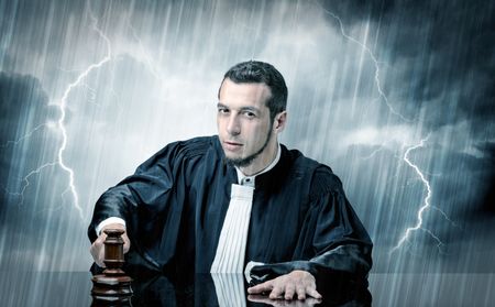 Young handsome judge with stormy wallpaper 