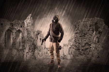 Hazard, menace man in a ruined crumbly building with arms on his hand