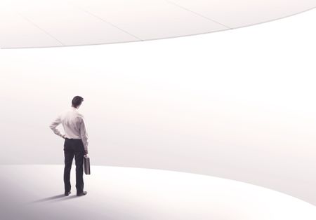 young-sales-business-person-elegant-suit-794247496 Young sales business person in elegant suit standing with his back in empty white space background with curved lines concept