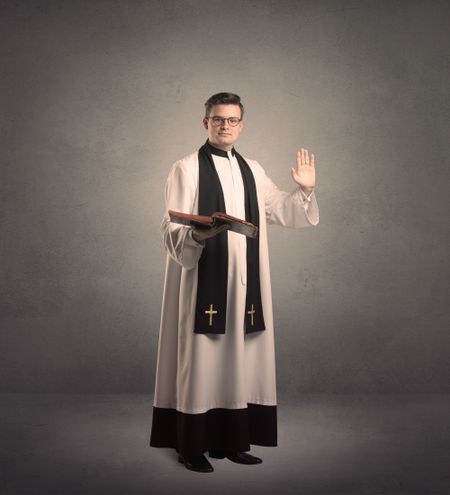 young priest in giving his blessing