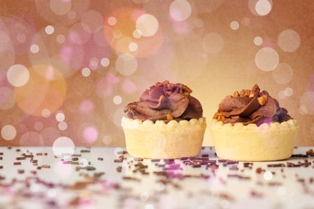 Close up of delicious tasty homemade cakes with bokeh light background