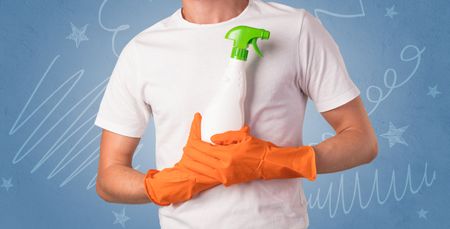 Swabber with orange rubber gloves and doodle concept on wallpaper

