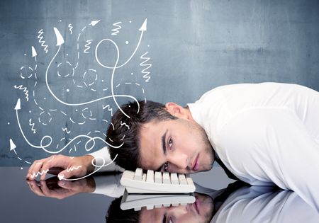 A depressed businessman resting his head on a keyboard and shouting with illustration of ideas, arrows, lines leaving his head concept