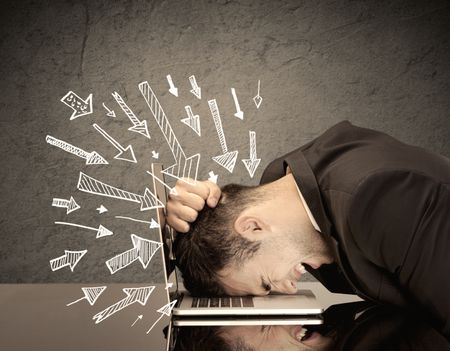 An exhausted business person resting his head on keyboard with pressure illustrated by arrows pointing at him concept