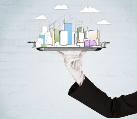 Serving a city concept with close up of waiter hand in gloves holding silver plate in front of grey brick wall