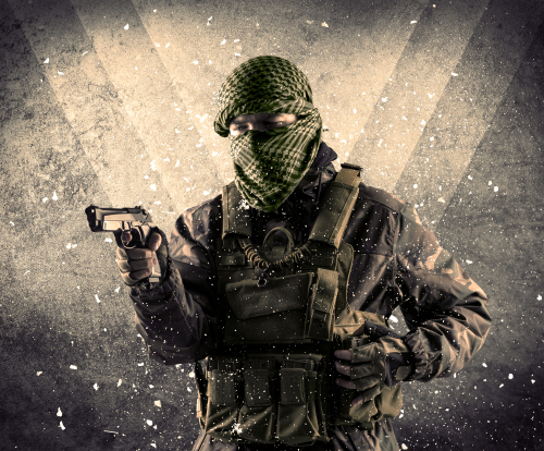 Portrait of a dangerous masked armed soldier with grungy light background 