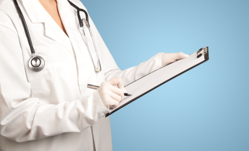 Female doctor holding notepad with blue background 
