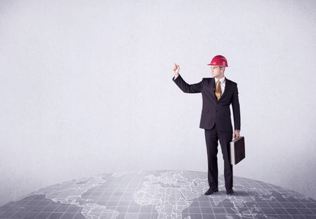 An elegant young male businessman standing on top of the world, pointing up concept with drawn earth map.